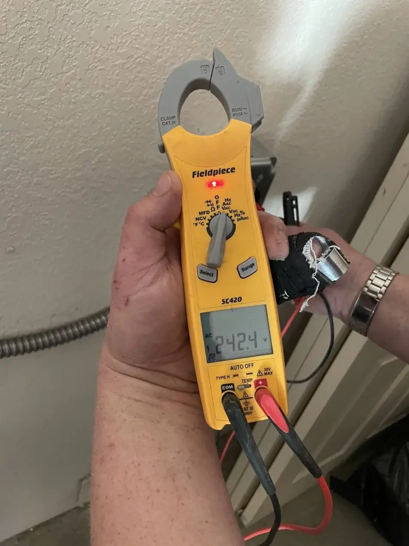 Voltage testing with clamp meter during Whole House Surge Protector in Patton